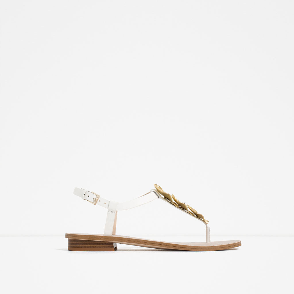 FLAT LEATHER SANDALS WITH FLORAL DETAIL